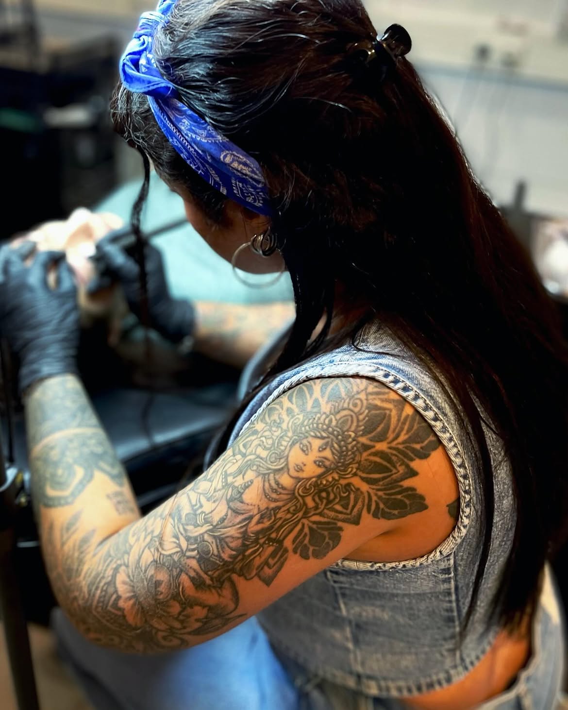 Wanda tattooing in her studio